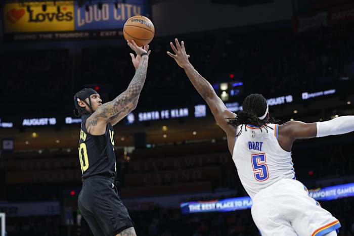 Utah Jazz guard Jordan Clarkson (00) shoots as Oklahoma City Thunder guard Luguentz Dort (5) defends the shot during the second half at Paycom Center.